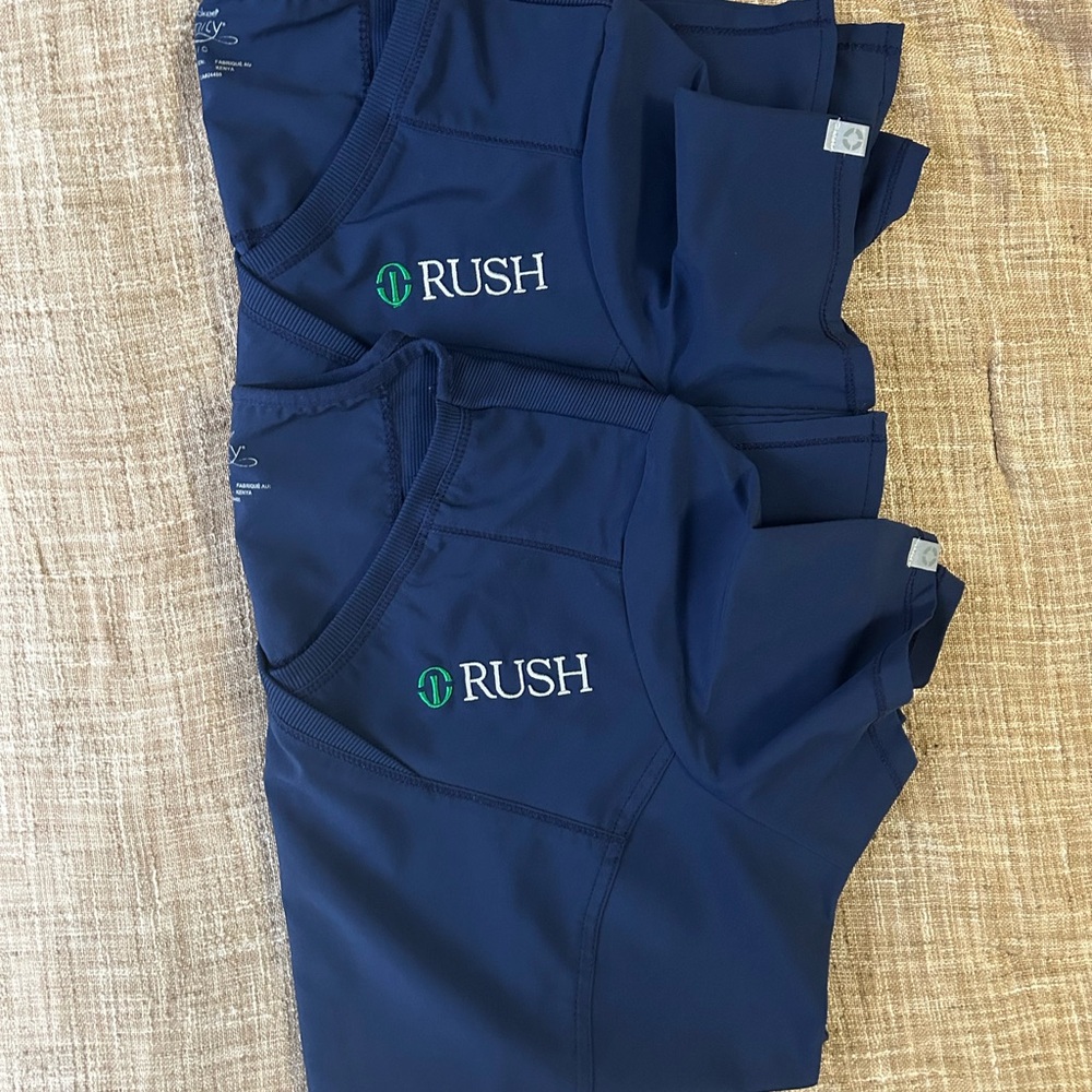 Two Cherokee brand Rush University Medical Center scrub tops